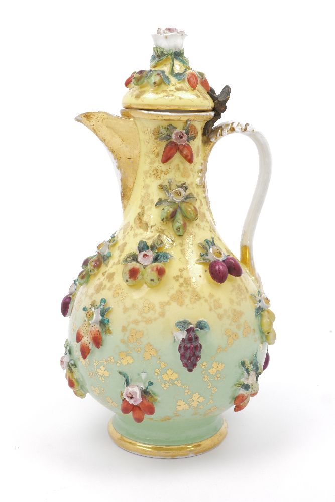 A Continental porcelain ewer, 19th century, with hinged lid, overall applied with fruit, flowers and