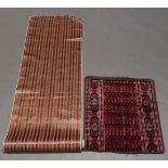 A section of silk cloth of Ikat design, 20th century, dyed with white hooked designs with green