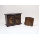 A small 20th century Chinese two door jewellery cabinet with a single interior compartment, the