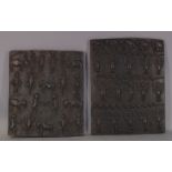 A pair of African stained half relief carved hardwood panels depicting various figures and