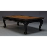 A Chinese low table, late 19th, early 20th Century, the rectangular top inset with rattan panel,