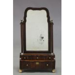 A George II mahogany toilet mirror, the shaped frame with beveled mirror plate, on moulded