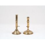 An English brass pusher candlestick, circa. 1700, of typical form, with cylindrical socket and
