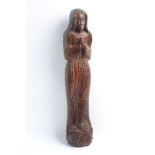 A Northern European wood carving, 15th century, depicting Mary Magdalene in prayer, in a red bole