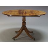 A Regency style mahogany breakfast table, early 20th Century, the circular sunburst veneered top, on