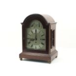 An Edwardian mahogany cased bracket clock, with dome cover, the brass dial with roman numerals,