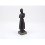 An early 20th century Bronze figure, designed as a Mother and Child, to an onyx square plinth