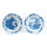 An 18th century Dutch Delft Ware charger, decorated in blue and white stylised naturalistic forms,