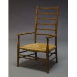 Liberty & Co, An Arts and Crafts beech ladderback side chair, with rush seat on tapered legs