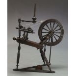 An oak spinning wheel, 19th Century, with turned tripod supports, 102cm high, approx. 87cm
