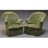 A Pair of late Victorian tub armchairs, upholstered in green velvet upholstery, with tasseled