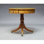 A Regency mahogany drum table, the circular top inset with green leather surface, the frieze with