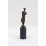 A late 16th/early 17th century bronze female figure, in contrapposto pose and drapery, to a
