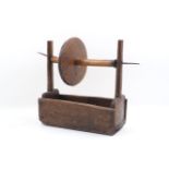 An 18th century wooden wool winder, of typical form, with mechanised winder, 50cm longPlease refer