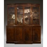 A George III style mahogany breakfront bookcase, late 20th Century, the dentil moulded cornice above