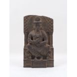 A carved Gandara stone figural plaque, in 2nd/3rd century AD style, depicting seated Budda,