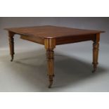 A Victorian mahogany extending dining table, the rounded rectangular top, with two additional leaves