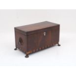 A George III mahogany inlaid cross banded three-section tea caddy, with glass liner and removable