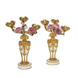 A pair of French ormolu and white marble three branch candelabra, early/ mid 20th century, the bases