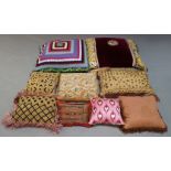 A selection of decorative cushions, of varying sizes and colour ways, to include, two large