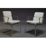 A pair of chromed cantilever armchairs by Luxy, Italia, c.1970-80, with cream leather upholstered