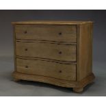 Feather and Black, a limed oak serpentine chest of drawers, of recent manufacture, with three