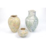 Vivian Legge, British, 20th century, three porcelain vases decorated with flowers and leaves, signed