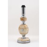 A 20th century onyx lamp base, designed with three discoid form stones, recurrently layered with