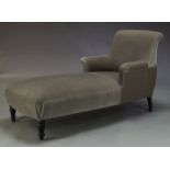 A modern grey velvet chaise longue, of recent manufacture, with curved back above conforming arms,