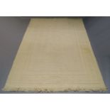 A Scandinavian wool cream ground carpet, with raised field and Greek key border, 336cm x 238cmPlease