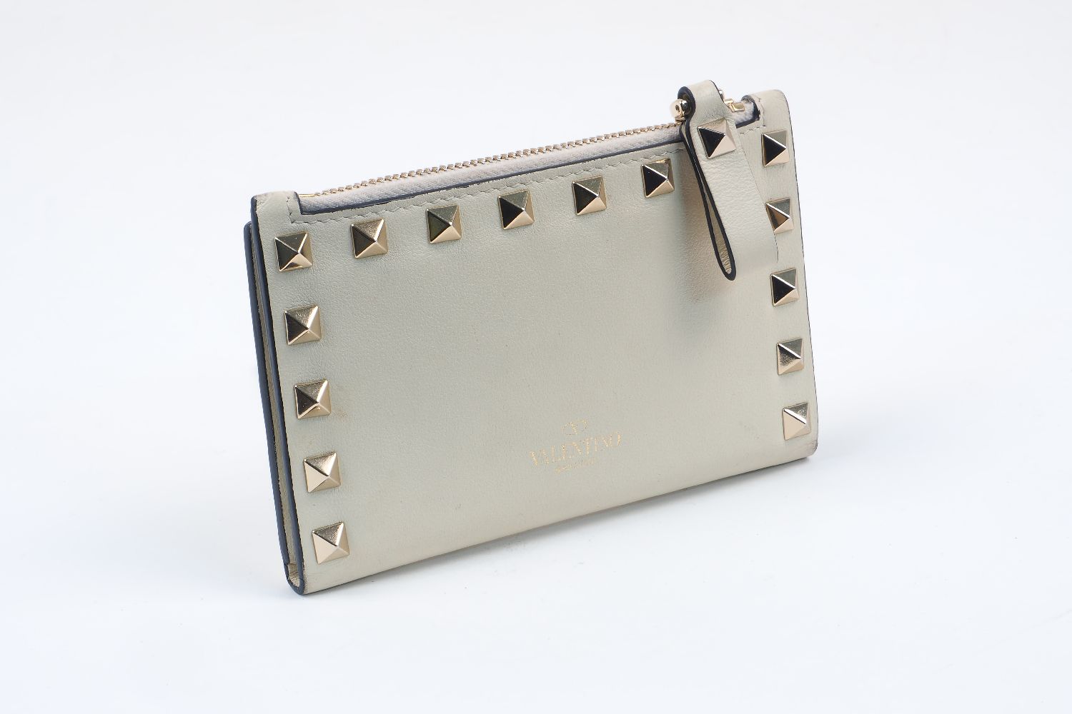 A Valentino Garavani 'Rockstud' calfskin leather purse, the folding body with six card holder slots,