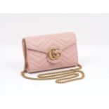 A Gucci Mini Marmont Matelassé shoulder bag, the rectangular form bag with characteristic