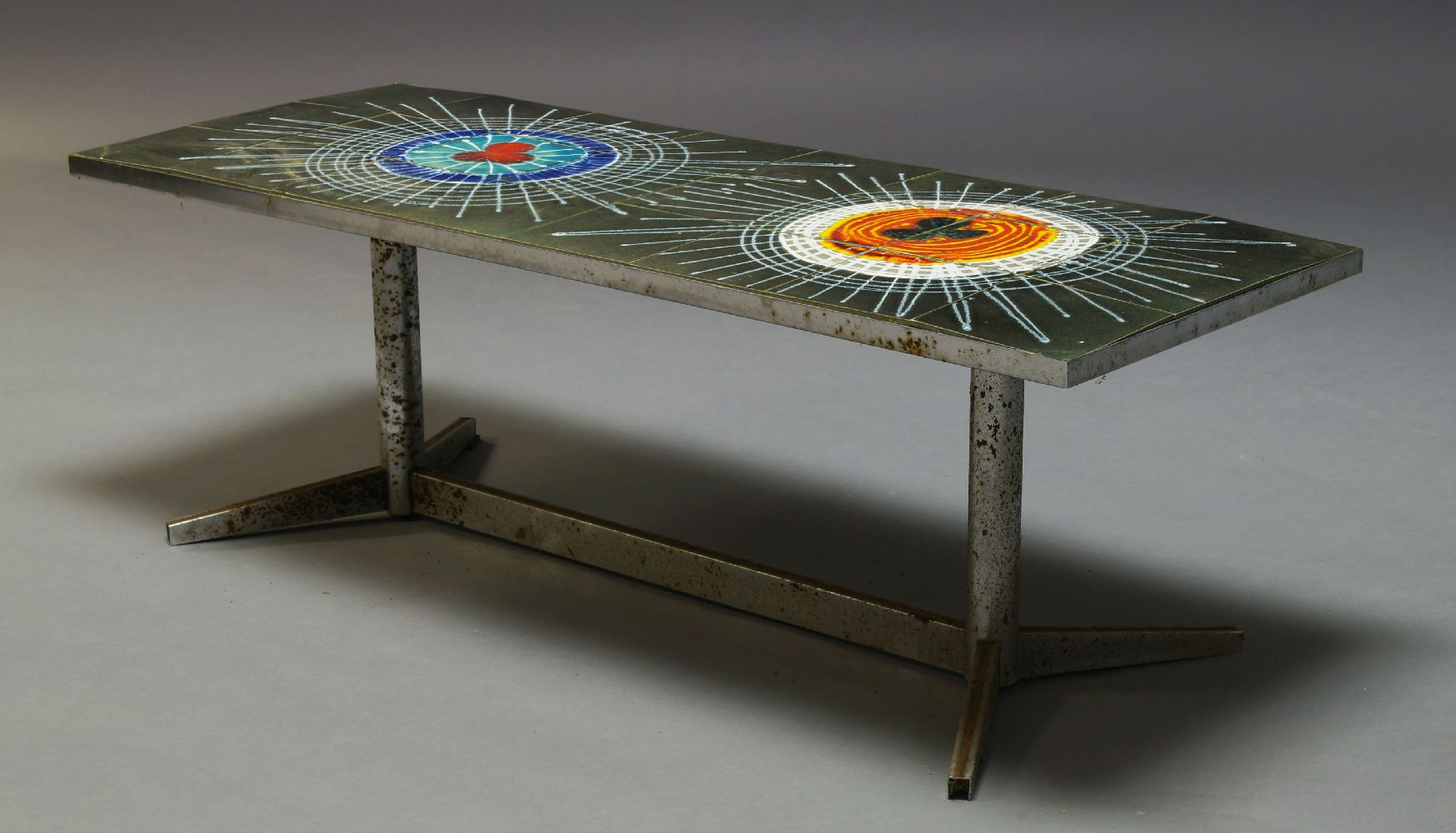 A tile and chromed coffee table, c.1960, inset with grey and polychrome tiles with abstract