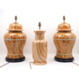 A pair of table lamps, each of baluster form, with faux wood grain colouration, electrical