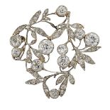 A Belle Epoque diamond brooch, designed as an openwork floral cluster spray set with old-brilliant-