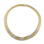 A two-colour gold and diamond chevron link collar necklace, composed as a series of flexible,