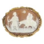 A late 19th century gold-mounted shell cameo brooch, the oval cameo carved to depict Joseph