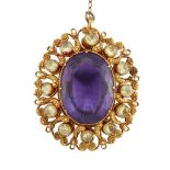 An amethyst and chrysolite cannetille pendant, the cushion cut amethyst to a pierced, gold