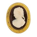 A late 19th century Russian, gold mounted agate cameo brooch, the cameo depicting a female