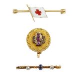 Two early 20th century gem set and one enamel brooch, including a Russian enamelled Red Cross flag
