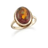 A Mexican fire opal single stone ring, the single cabochon opal in collet-setting with ropework