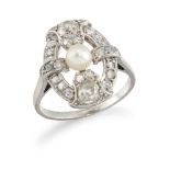 A platinum, diamond and pearl oval cluster ring, of openwork quatrefoil design, the central pearl (