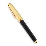 A gold plated and black lacquer fountain pen by Cartier, the black lacquer slightly tapered body