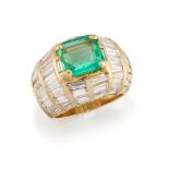 An emerald and diamond ring, the cut-cornered rectangular emerald to a baguette and tapered