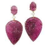 A pair of pink tourmaline and diamond earrings, the carved pear shaped pink tourmaline plaque