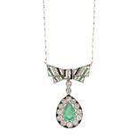 A Belle Epoque, emerald, diamond and onyx bow pendant necklace, designed as a pear-shaped emerald