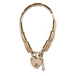 A late nineteenth century rose gold gate link bracelet, with heart shaped padlock clasp, approx.