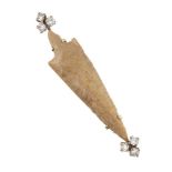 A diamond and Neolithic arrowhead limited edition brooch, by Garrard, each terminal of the pointed