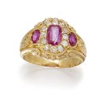 A ruby and diamond cluster ring, the central cushion shaped ruby within an old-cut diamond