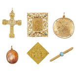 A small group of jewellery, comprising: three religious plaques, including one mounted as a